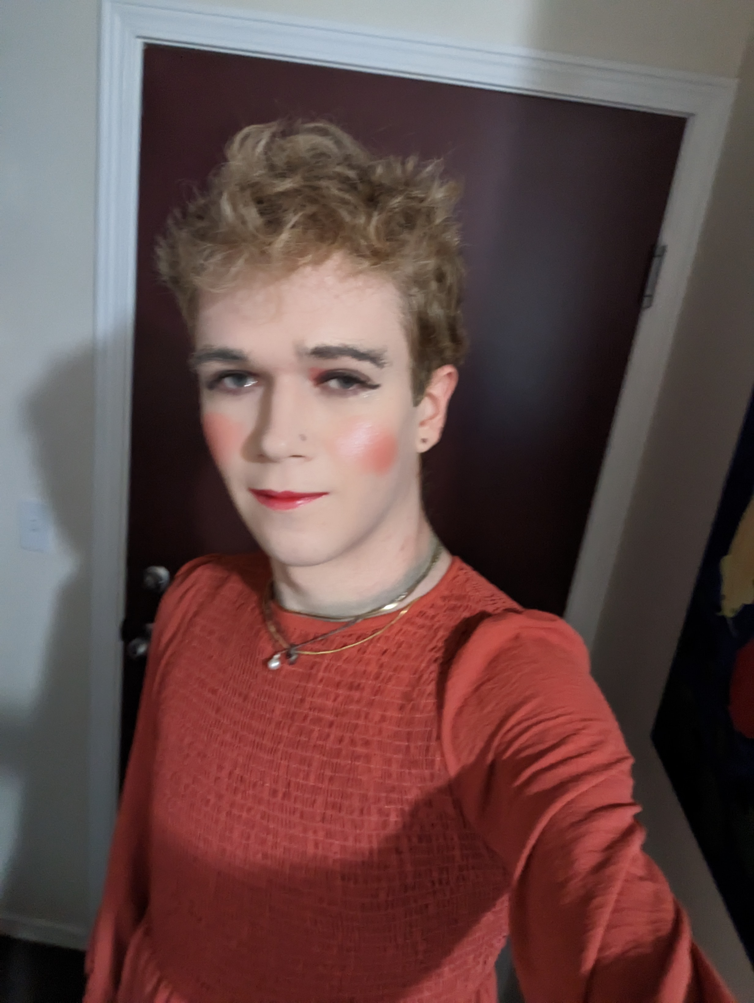 This photo shows a woman with curly light brown hair wearing... - by Daisy