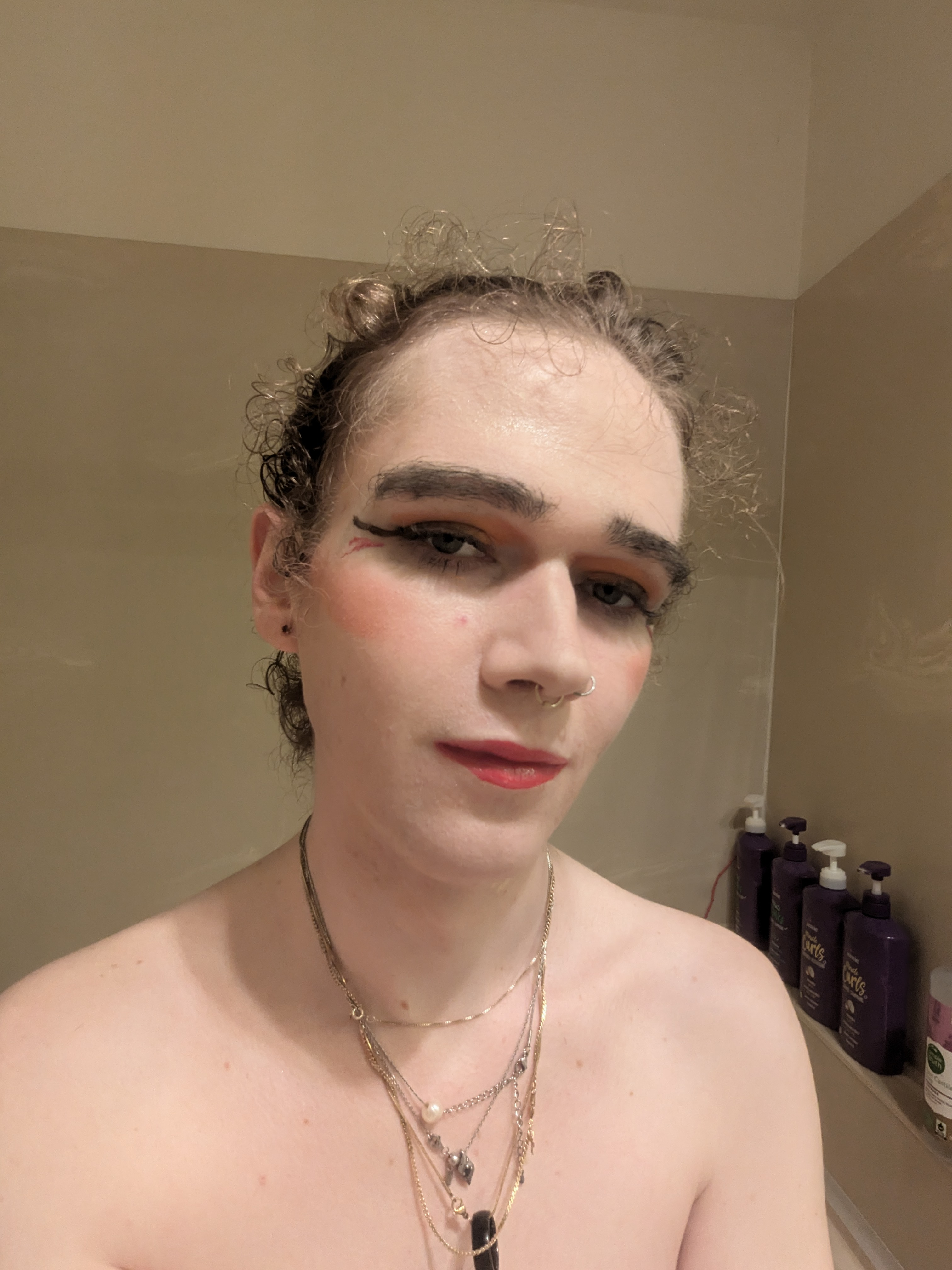 A woman with a piercing and a wig. - by Daisy