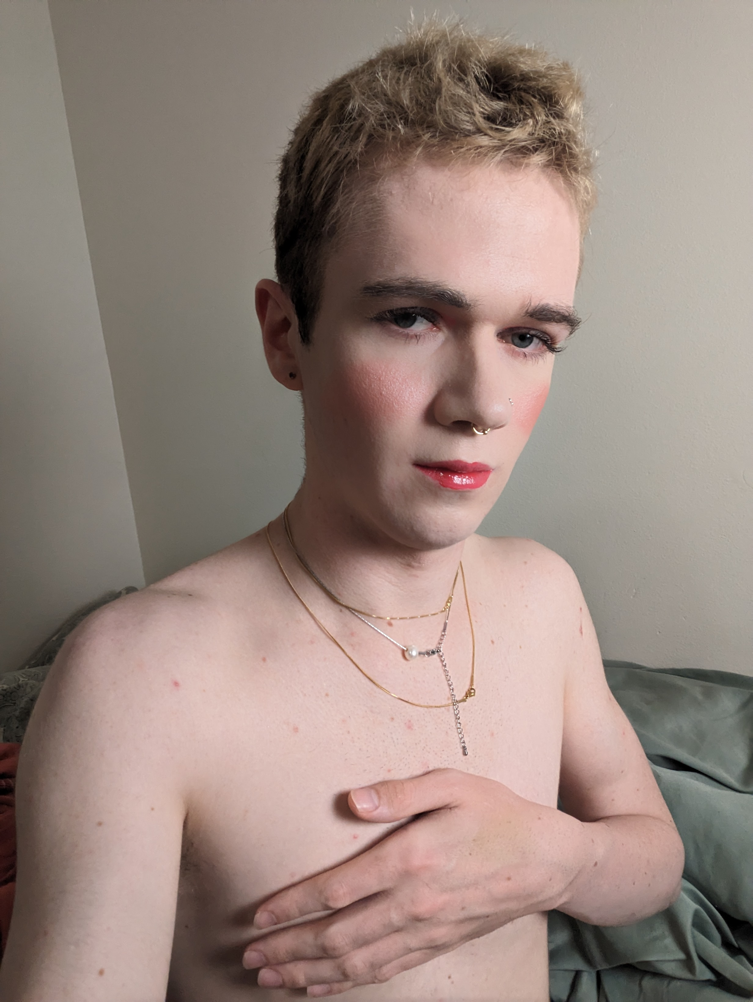 This photo shows a woman with short, light-colored hair. She has... - by Daisy