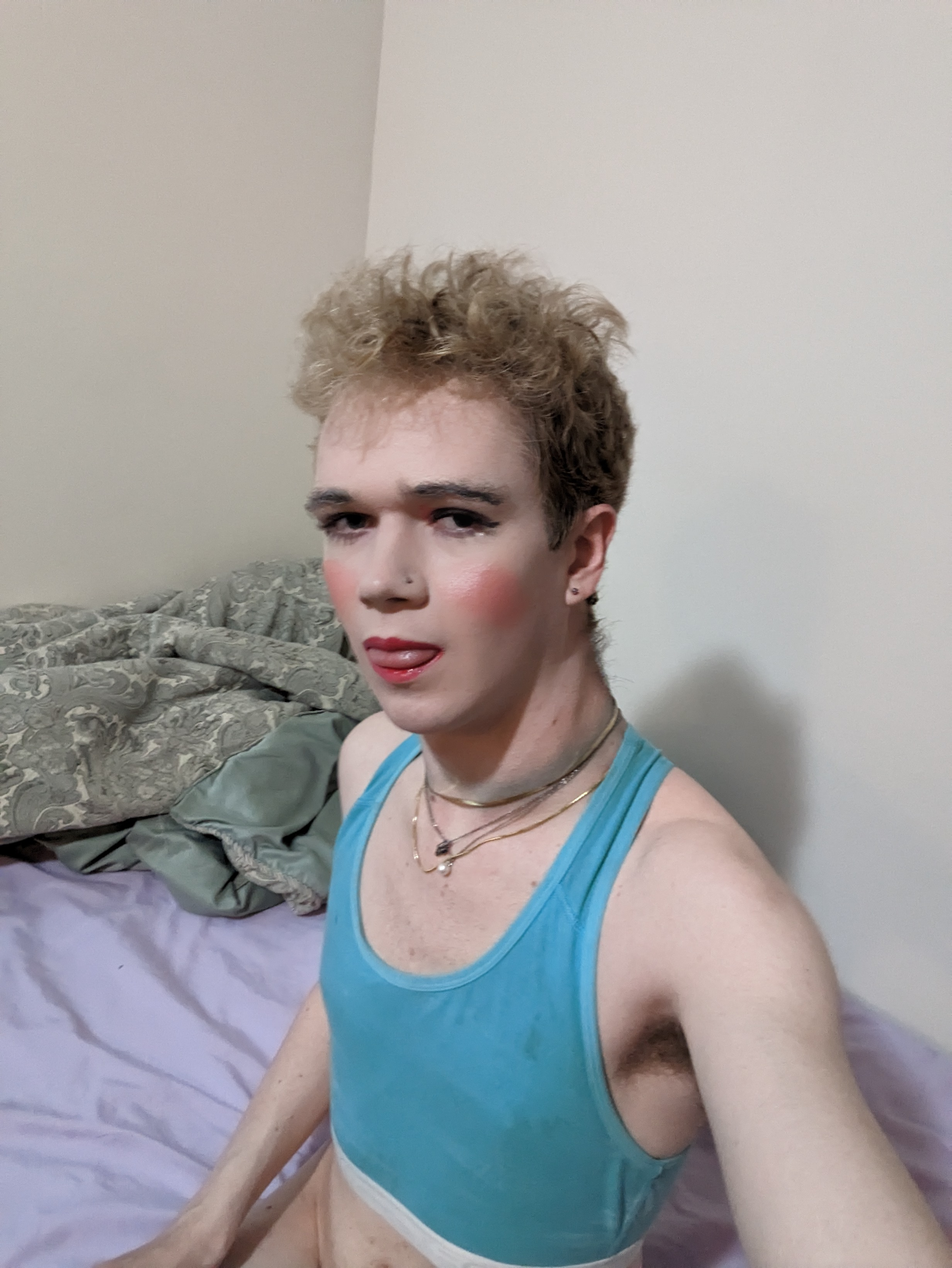 The photo shows a woman with light curly hair wearing a light blue... - by Daisy